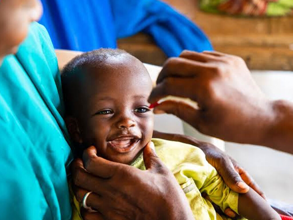 A child receiving care during medical outreach